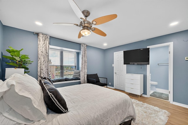 3663 Nasa Pkwy Unit 301, Seabrook, TX 77586 - bedroom featuring wood finished floors, recessed lighting, ceiling fan, and ensuite bath