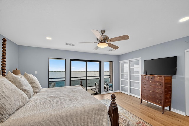 3663 Nasa Pkwy Unit 301, Seabrook, TX 77586 - bedroom with access to exterior, light wood-type flooring, recessed lighting, and ceiling fan