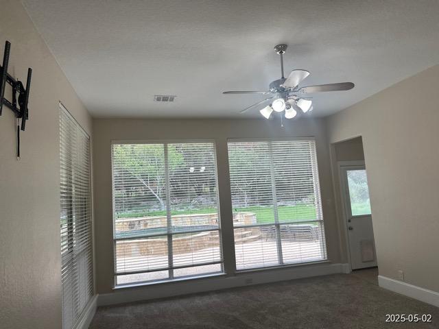 1715 Palmer Vw, San Antonio, TX 78260 - doorway to outside featuring carpet floors and a ceiling fan