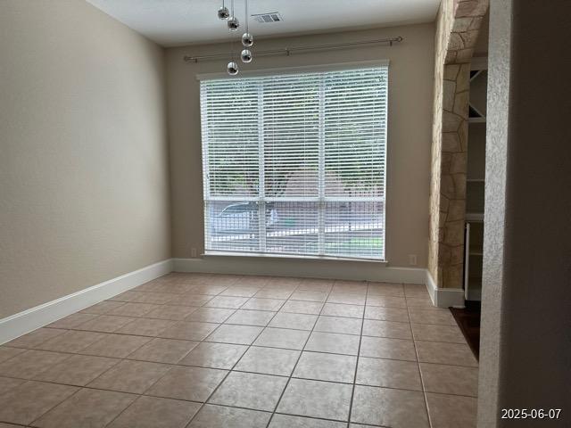 1715 Palmer Vw, San Antonio, TX 78260 - unfurnished dining area with light tile patterned floors and baseboards