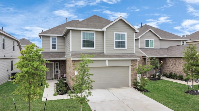 2832 Madison Dr, Conroe, TX 77304 - view of front of home with brick siding, a garage, a front lawn, and roof with shingles