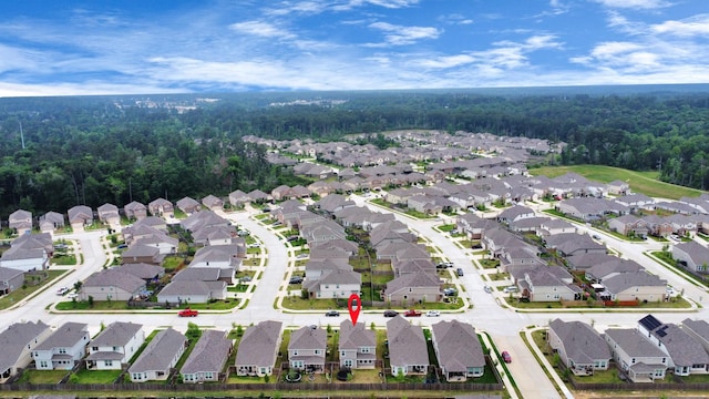 2832 Madison Dr, Conroe, TX 77304 - aerial view of property's location with nearby suburban area and a heavily wooded area