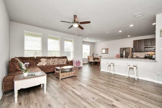 2832 Madison Dr, Conroe, TX 77304 - living room with light wood-type flooring, ceiling fan, and recessed lighting