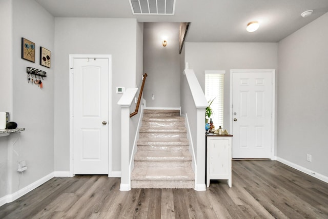 2832 Madison Dr, Conroe, TX 77304 - stairs featuring wood finished floors