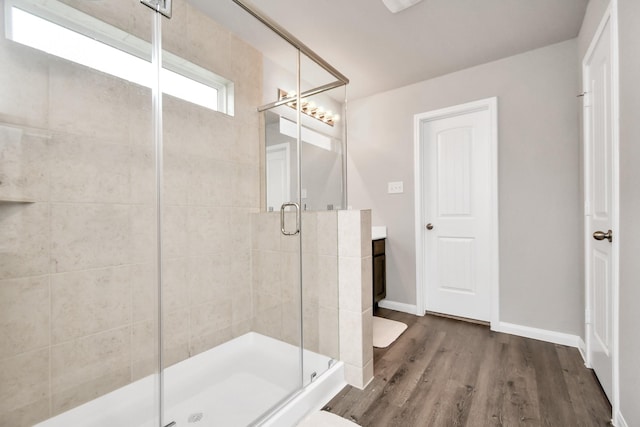 2832 Madison Dr, Conroe, TX 77304 - full bath featuring a stall shower, wood finished floors, and vanity