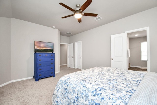 2832 Madison Dr, Conroe, TX 77304 - bedroom with light carpet and a ceiling fan