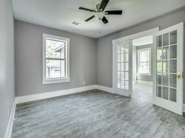 810-812 Maltby St Unit 6, Houston, TX 77011 - unfurnished room featuring french doors, wood finished floors, and ceiling fan