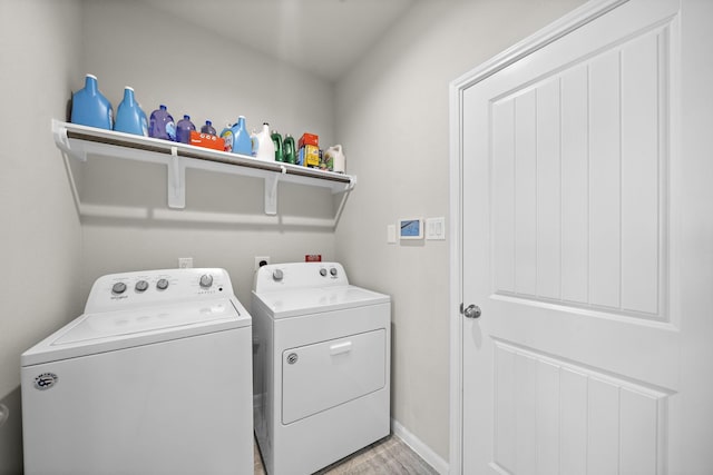 5442 Atwood Canyon Ct, Richmond, TX 77407 - laundry area featuring washer and clothes dryer and light wood-style flooring