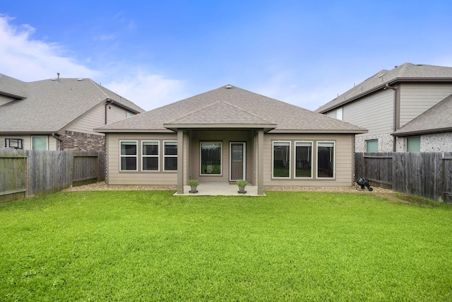 5442 Atwood Canyon Ct, Richmond, TX 77407 - rear view of house with a fenced backyard, a shingled roof, and a patio area