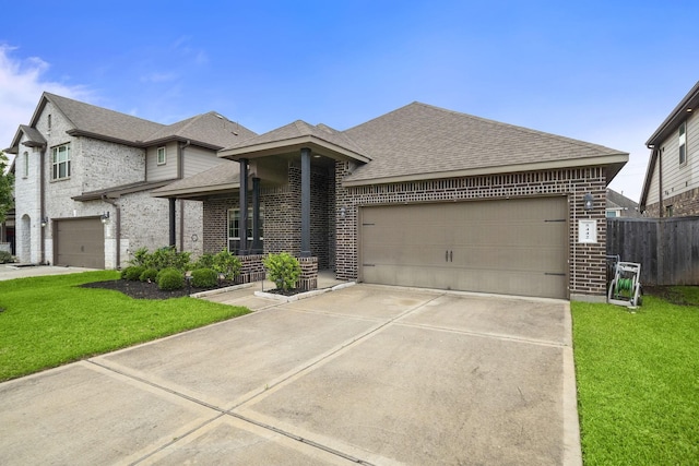 5442 Atwood Canyon Ct, Richmond, TX 77407 - french provincial home with brick siding, a shingled roof, concrete driveway, and an attached garage