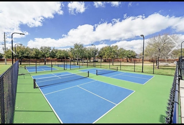 5442 Atwood Canyon Ct, Richmond, TX 77407 - view of tennis court featuring community basketball court