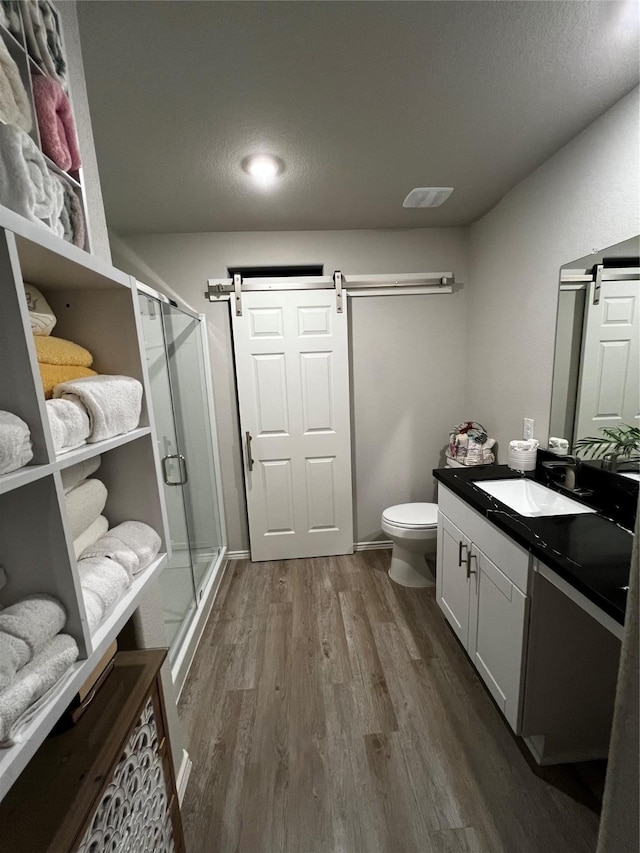 278 Cumberland Forest Dr, Magnolia, TX 77354 - full bath with wood finished floors, vanity, and a shower stall