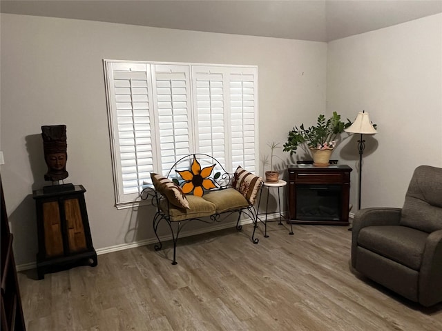 278 Cumberland Forest Dr, Magnolia, TX 77354 - sitting room with wood finished floors and lofted ceiling