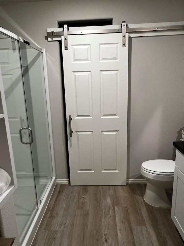278 Cumberland Forest Dr, Magnolia, TX 77354 - bathroom featuring wood finished floors, a stall shower, and vanity