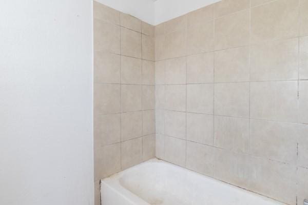 7973 Ritz St, Houston, TX 77028 - bathroom with a bath and a shower