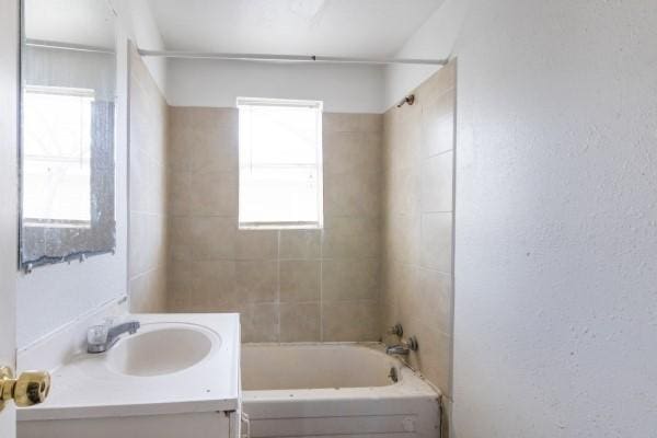 7973 Ritz St, Houston, TX 77028 - bathroom with healthy amount of natural light, vanity, and shower / washtub combination