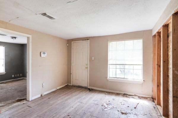7973 Ritz St, Houston, TX 77028 - entryway with baseboards and wood finished floors