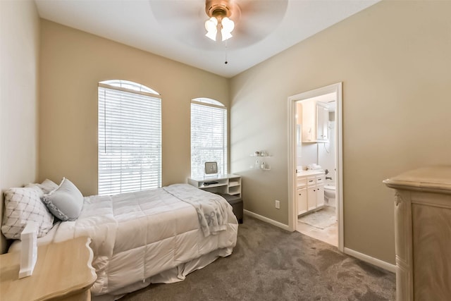 6402 Saint Jude Dr, Pasadena, TX 77505 - carpeted bedroom with connected bathroom and ceiling fan