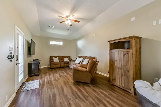 6402 Saint Jude Dr, Pasadena, TX 77505 - living room featuring ceiling fan, wood finished floors, and a raised ceiling