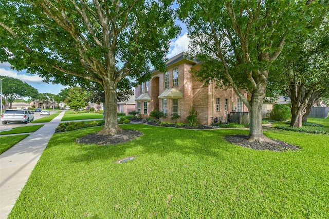 6402 Saint Jude Dr, Pasadena, TX 77505 - view of front facade featuring brick siding and a front yard