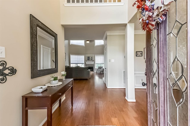 6402 Saint Jude Dr, Pasadena, TX 77505 - foyer entrance featuring wood finished floors, a fireplace, and a towering ceiling