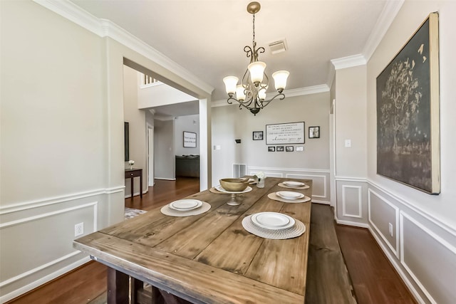 6402 Saint Jude Dr, Pasadena, TX 77505 - dining space with ornamental molding, a chandelier, dark wood-style floors, a decorative wall, and a wainscoted wall