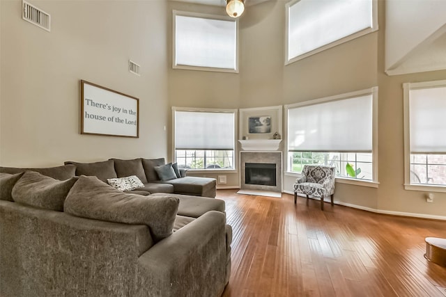 6402 Saint Jude Dr, Pasadena, TX 77505 - living area with a towering ceiling, hardwood / wood-style flooring, and a fireplace