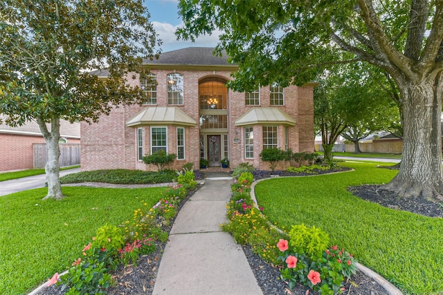 6402 Saint Jude Dr, Pasadena, TX 77505 - view of front of home featuring brick siding and a front lawn