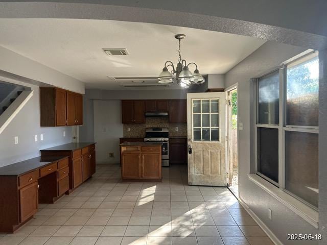 7306 Ellerby Pt, San Antonio, TX 78240 - kitchen featuring electric range, dark countertops, extractor fan, a chandelier, and light tile patterned floors