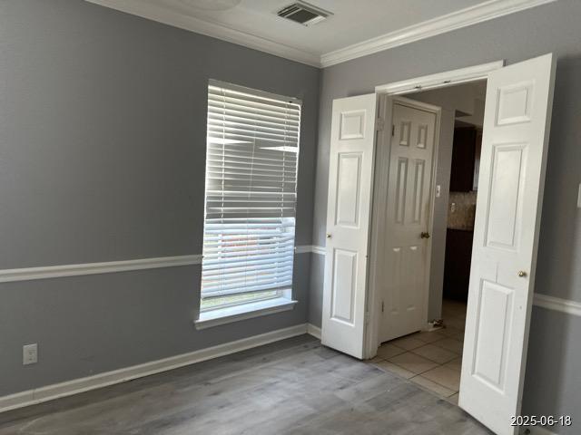 7306 Ellerby Pt, San Antonio, TX 78240 - spare room featuring ornamental molding and baseboards