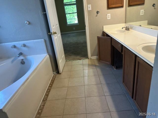 7306 Ellerby Pt, San Antonio, TX 78240 - bathroom with double vanity, a garden tub, and tile patterned floors