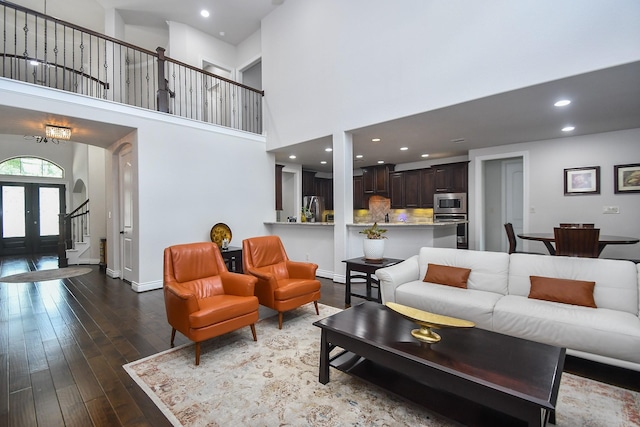 2710 Indigo Manor Ln, Katy, TX 77494 - living room featuring stairway, dark wood-type flooring, a high ceiling, and recessed lighting