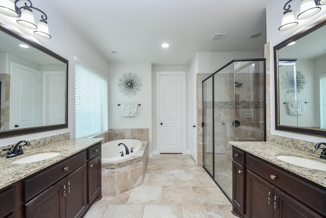 2710 Indigo Manor Ln, Katy, TX 77494 - bathroom with a shower stall, two vanities, a bath, and recessed lighting
