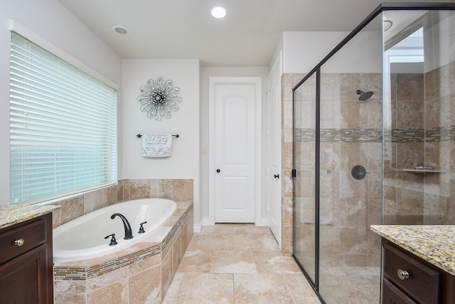2710 Indigo Manor Ln, Katy, TX 77494 - bathroom featuring a garden tub, vanity, a shower stall, and recessed lighting