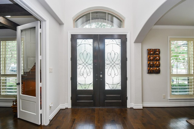 2710 Indigo Manor Ln, Katy, TX 77494 - entryway featuring dark wood-type flooring, french doors, arched walkways, and crown molding