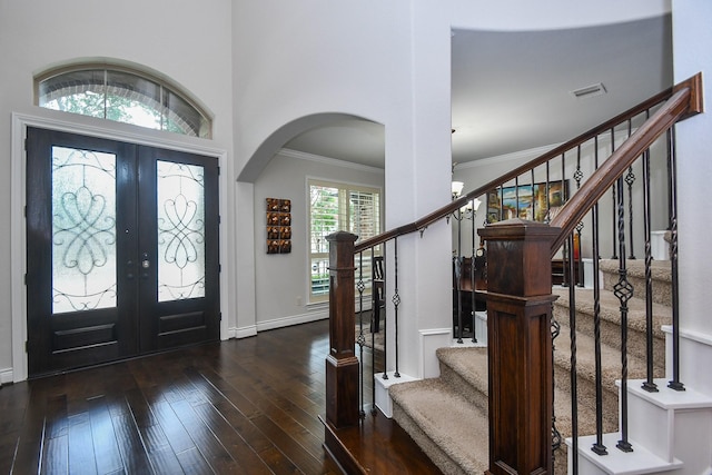 2710 Indigo Manor Ln, Katy, TX 77494 - entryway with french doors, hardwood / wood-style floors, ornamental molding, stairway, and arched walkways