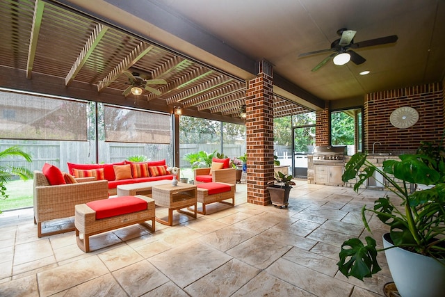 2710 Indigo Manor Ln, Katy, TX 77494 - fenced backyard with ceiling fan, outdoor lounge area, exterior kitchen, and a patio