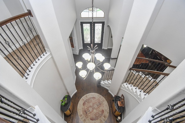 2710 Indigo Manor Ln, Katy, TX 77494 - entryway featuring a towering ceiling, a chandelier, stairway, and wood finished floors