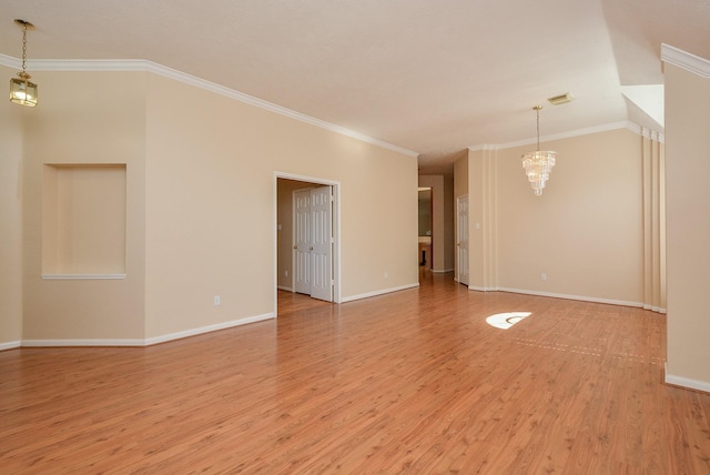 16902 Valley Palms Dr, Spring, TX 77379 - unfurnished room featuring a chandelier, light wood finished floors, and crown molding