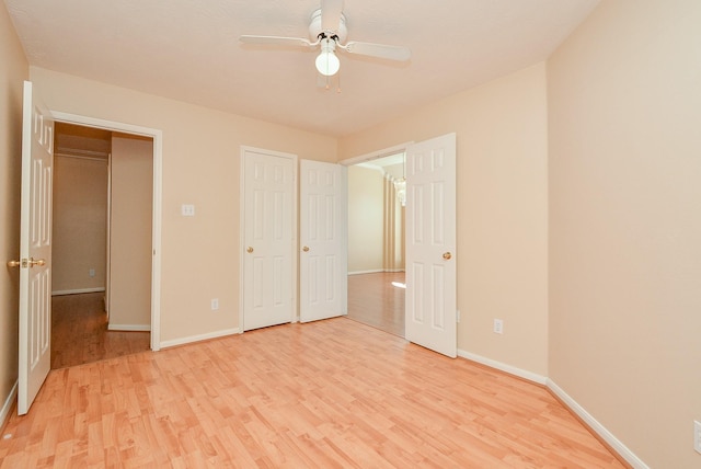 16902 Valley Palms Dr, Spring, TX 77379 - unfurnished bedroom with light wood finished floors and a ceiling fan