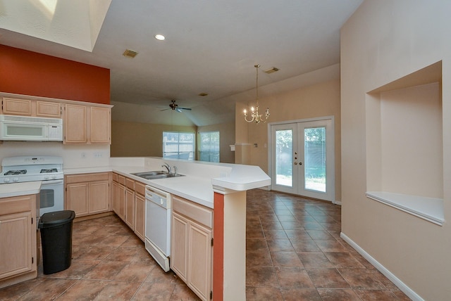 16902 Valley Palms Dr, Spring, TX 77379 - kitchen with white appliances, light brown cabinets, a peninsula, plenty of natural light, and recessed lighting