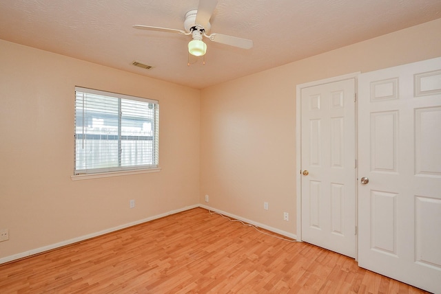 16902 Valley Palms Dr, Spring, TX 77379 - unfurnished bedroom with light wood-style flooring and ceiling fan