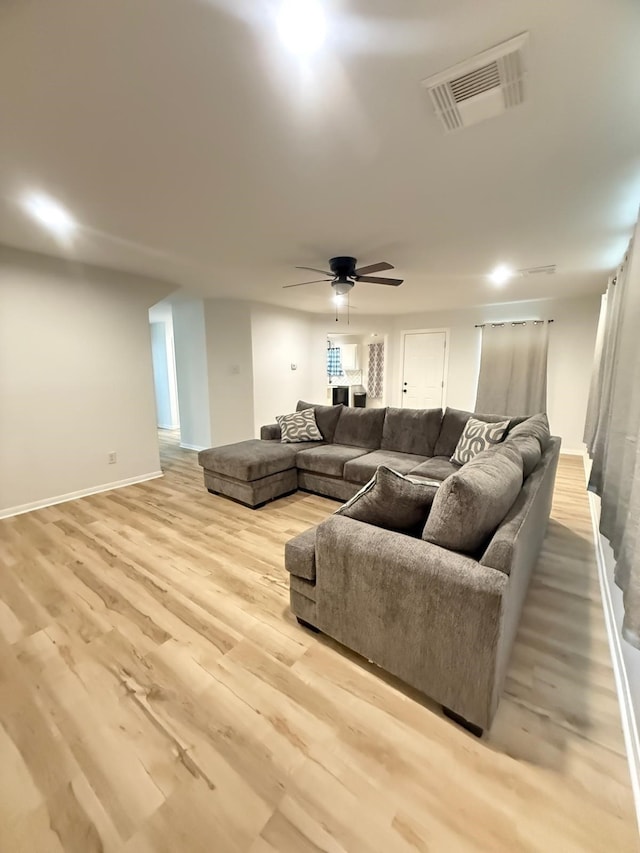 20918 Southhook Ct, Houston, TX 77073 - living area with light wood-style floors and ceiling fan