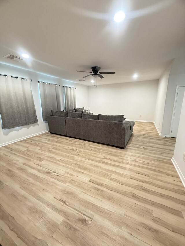 20918 Southhook Ct, Houston, TX 77073 - living room with light wood-style flooring, a ceiling fan, and recessed lighting