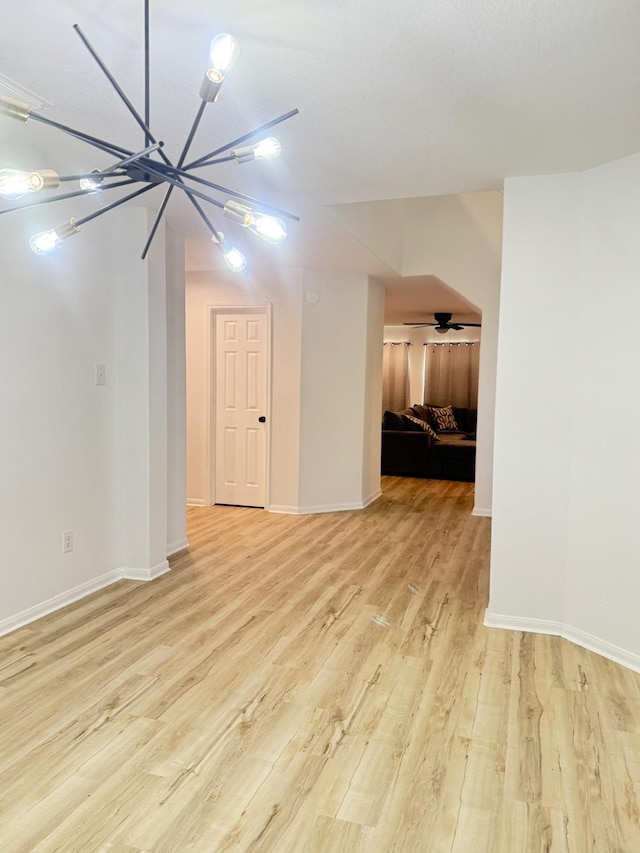 20918 Southhook Ct, Houston, TX 77073 - unfurnished living room featuring light wood-style floors and a chandelier