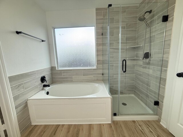 20918 Southhook Ct, Houston, TX 77073 - full bath featuring a garden tub, a stall shower, and wood finished floors