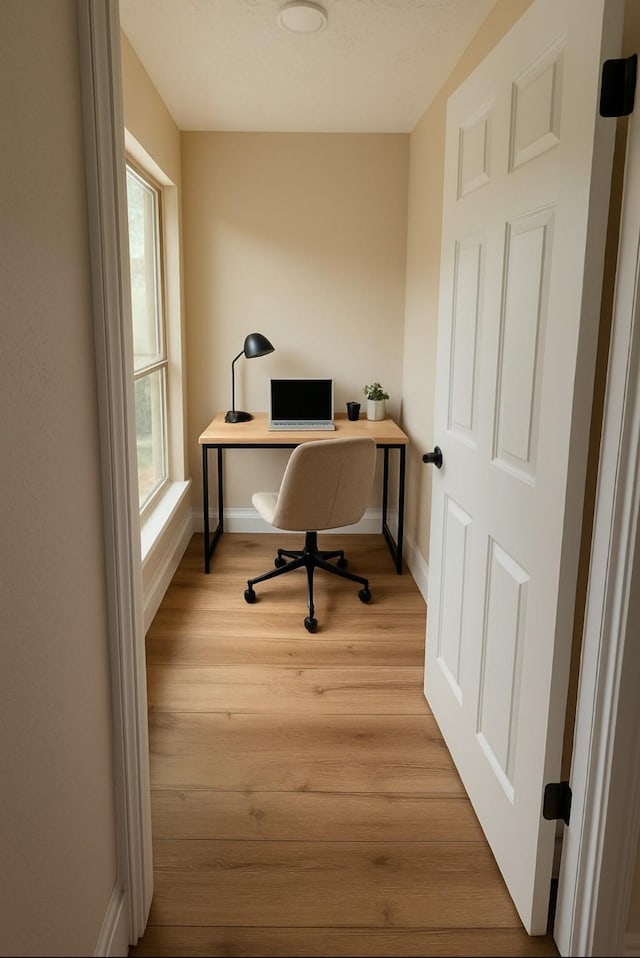 3407 Sandy Forks Dr, Houston, TX 77339 - office area featuring baseboards and wood finished floors