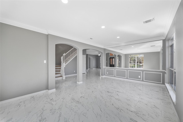 537 Green Cedar Dr, League City, TX 77573 - spare room with arched walkways, crown molding, recessed lighting, marble finish flooring, and stairway