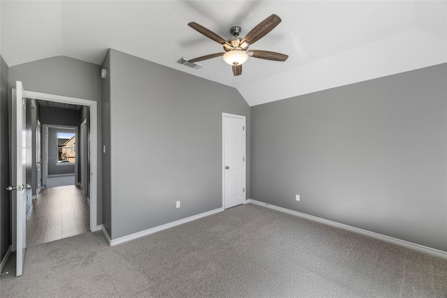537 Green Cedar Dr, League City, TX 77573 - unfurnished bedroom with vaulted ceiling, carpet floors, and a ceiling fan