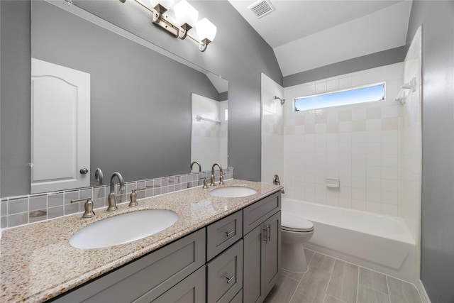 537 Green Cedar Dr, League City, TX 77573 - full bathroom featuring double vanity, shower / bathtub combination, and vaulted ceiling